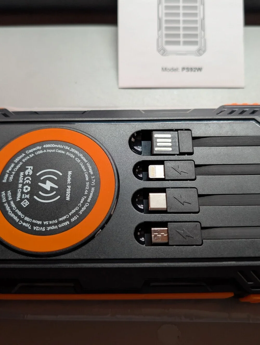 New/Sealed..42800mAh Rugged Portable Power Bank/Built-In Cables/ Wireless Pad